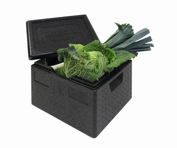 Schwarze Top-Box befüllt mit grünem Gemüse